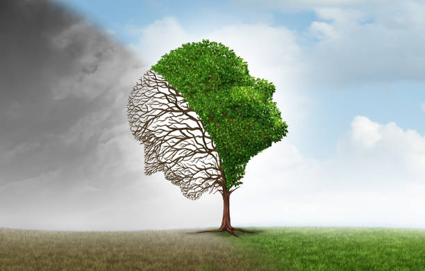 A tree shaped like a human profile, with bare branches and green leaves