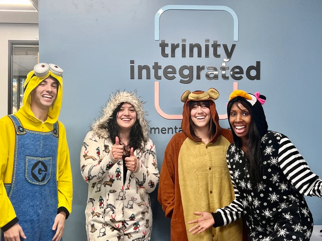 Trinity employees celebrating costume day together
